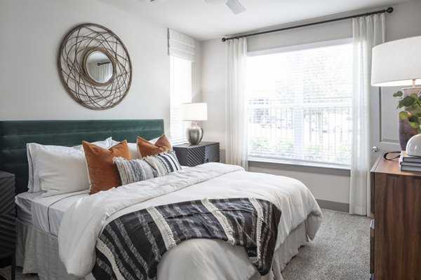 Bedroom featuring elegant decor and large windows at Broadstone Vintage Park Apartments