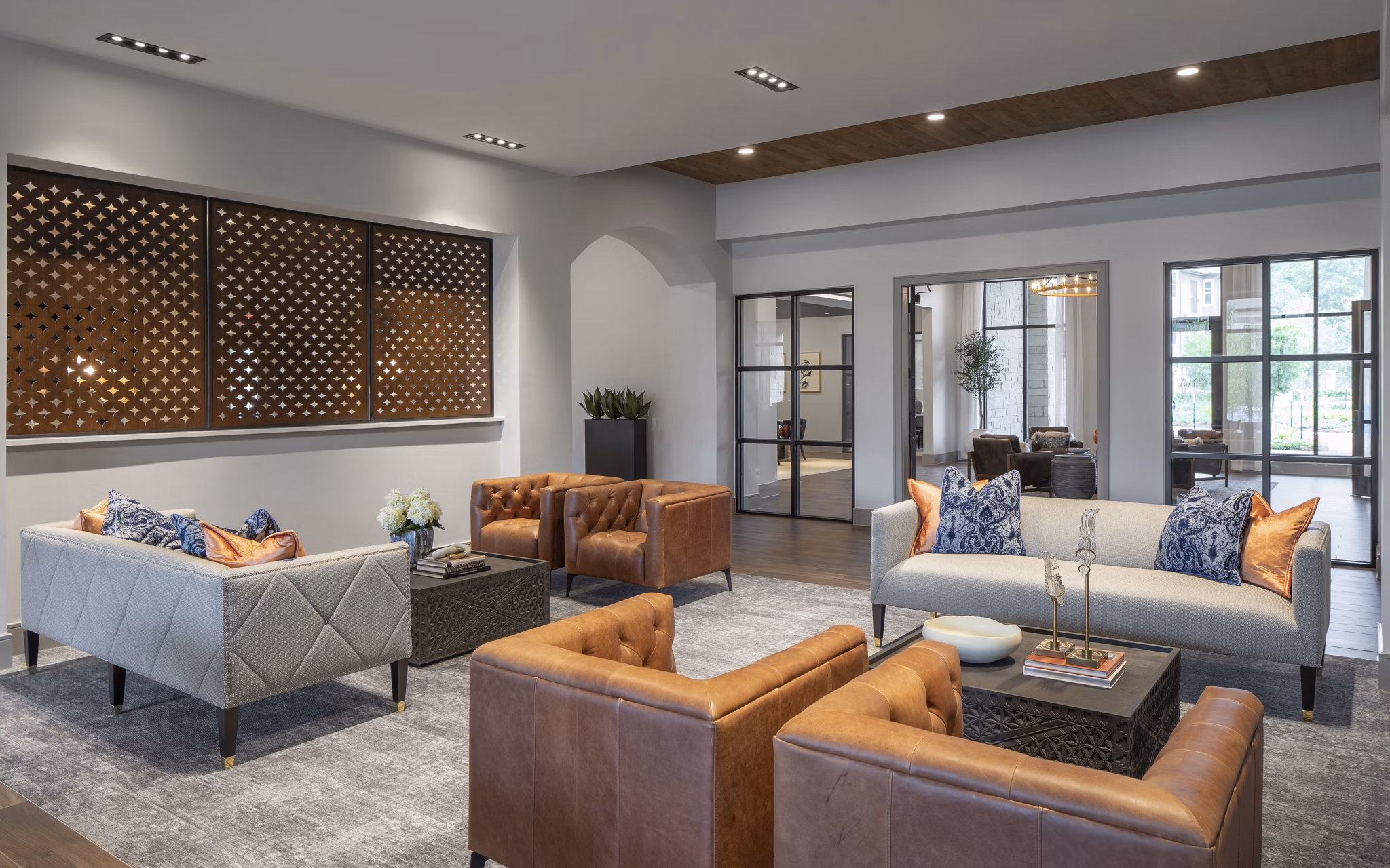 Clubhouse featuring elegant seating and grand fireplace at Broadstone Vintage Park Apartments