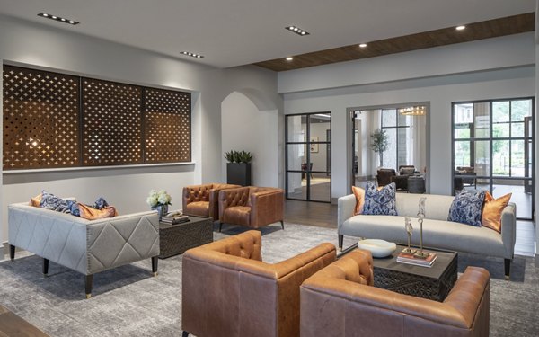 Clubhouse featuring elegant seating and grand fireplace at Broadstone Vintage Park Apartments