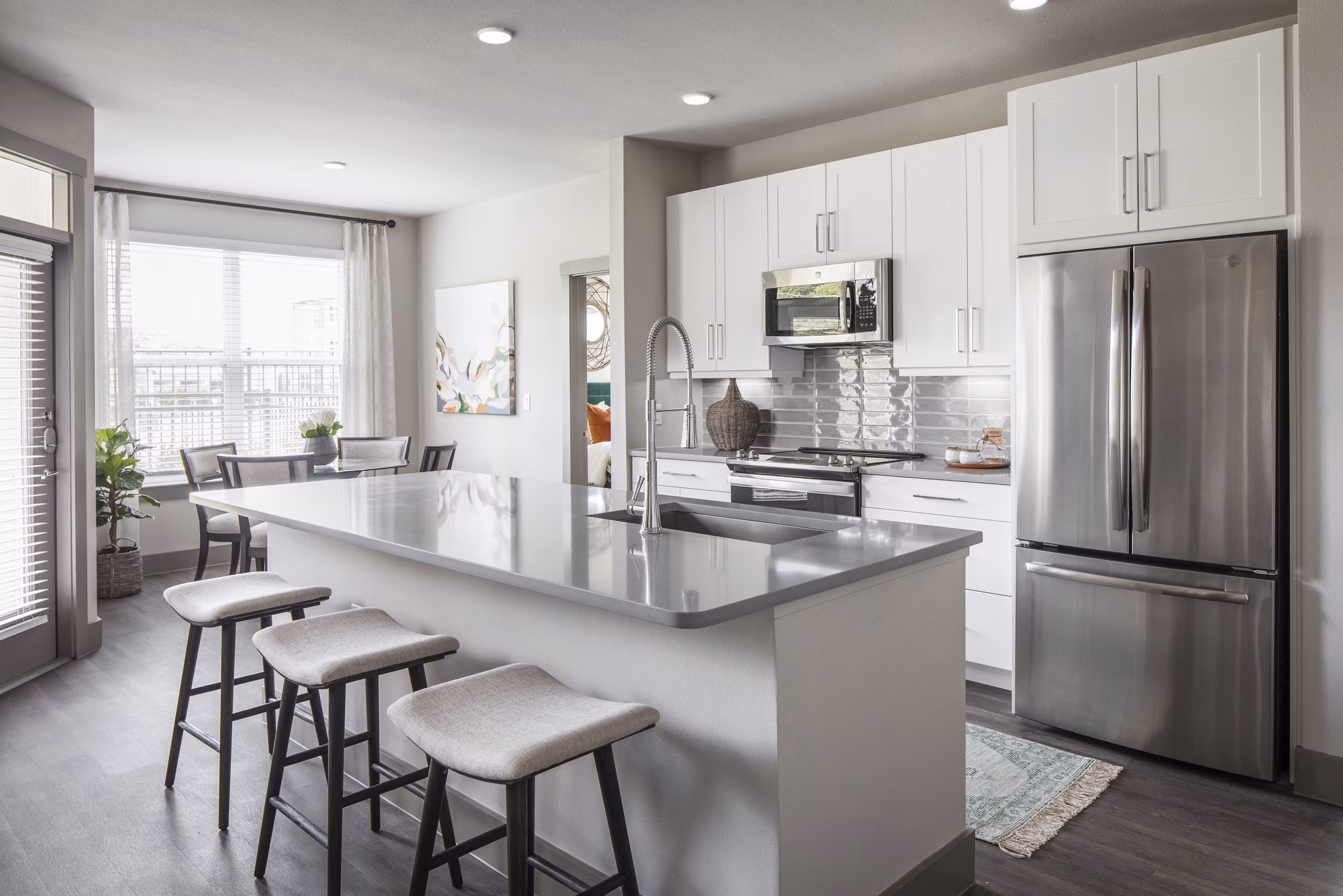 Modern kitchen with stainless steel appliances at Broadstone Vintage Park Apartments, featuring granite countertops and ample cabinet space