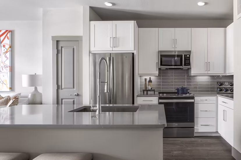 Modern kitchen with stainless steel appliances and granite countertops at Broadstone Vintage Park Apartments