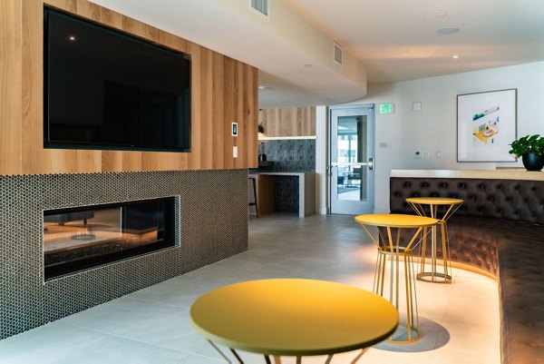 Clubhouse with stylish seating and modern decor at The Upper Ivy Apartments in Culver City, offering a luxurious space for residents to gather
