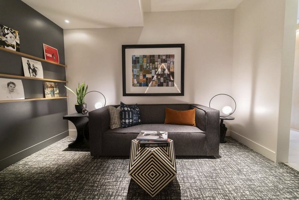 Modern clubhouse with stylish seating and large windows at The Upper Ivy Apartments