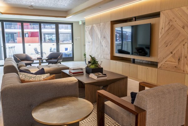The Upper Ivy Apartments: Elegant clubhouse with modern design and spacious seating areas in Culver City