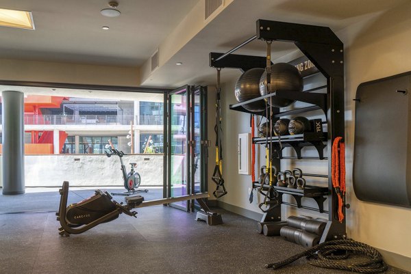 State-of-the-art fitness center with modern equipment at The Upper Ivy Apartments