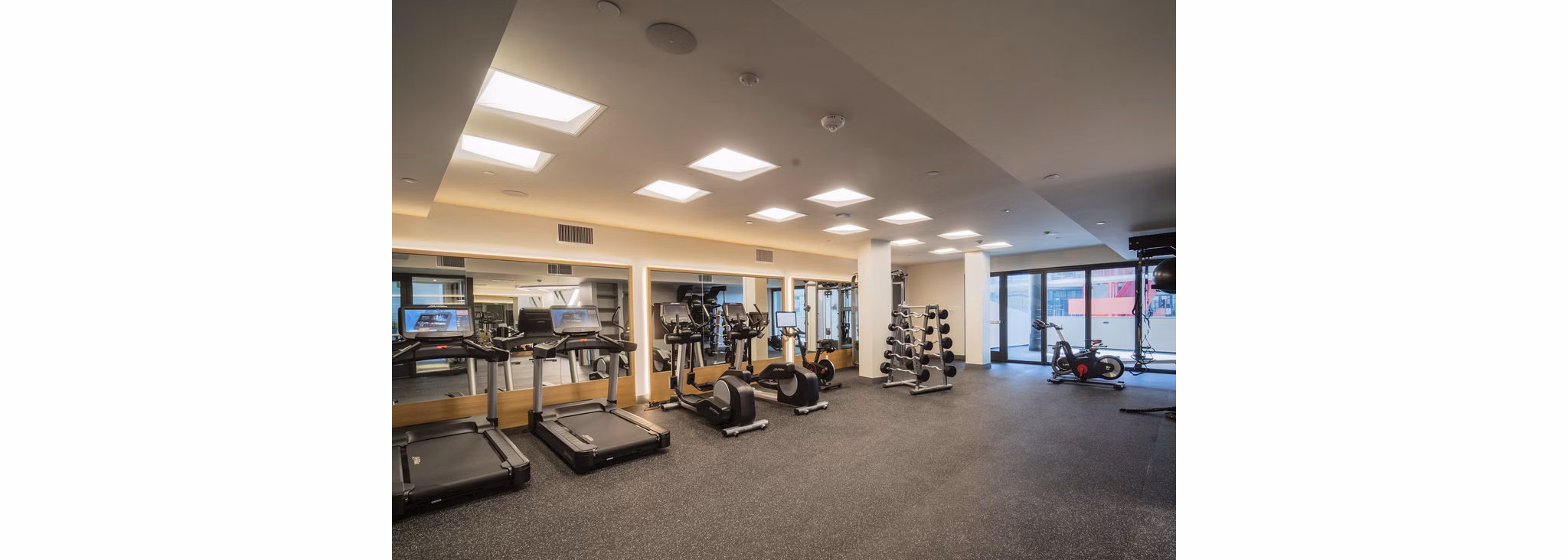 State-of-the-art fitness center with modern equipment at The Upper Ivy Apartments