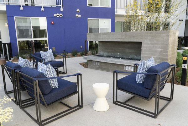 Cozy fire pit surrounded by seating at The Upper Ivy Apartments, a luxury Greystar property offering outdoor relaxation and social gatherings