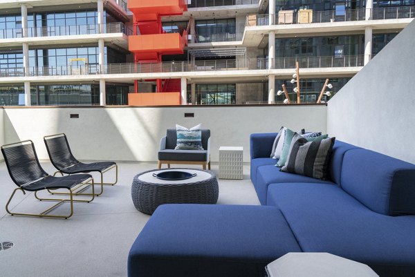 Cozy outdoor fire pit area with seating at The Upper Ivy Apartments, ideal for social gatherings and relaxation