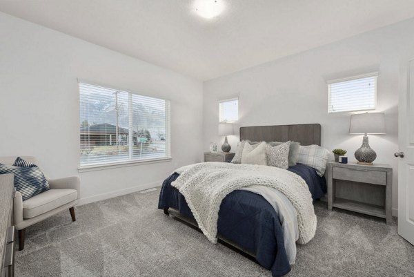 Cozy bedroom with modern furnishings at Haven Dell Apartments