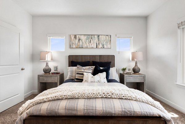 Cozy bedroom with king-size bed and modern decor at Haven Dell Apartments