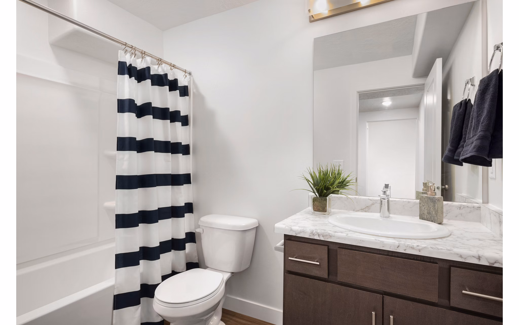 Luxurious bathroom featuring marble countertops and modern fixtures at Haven Dell Apartments