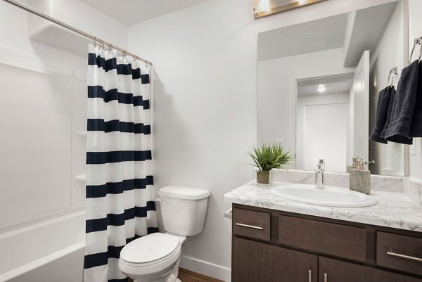 Luxurious bathroom featuring marble countertops and modern fixtures at Haven Dell Apartments