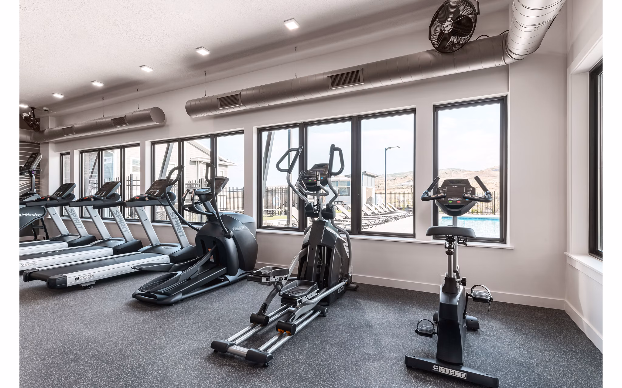 Spacious fitness center with modern equipment at Haven Dell Apartments, offering a luxurious workout experience for residents