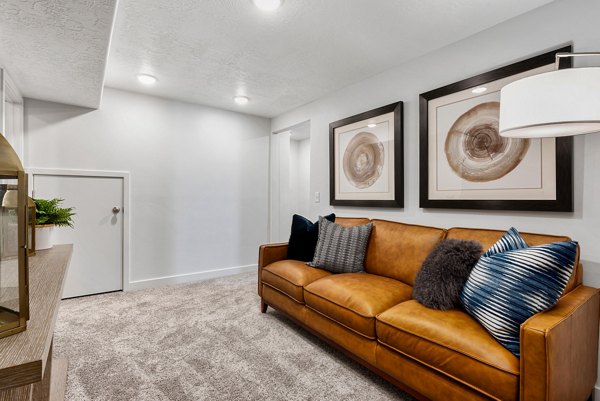 Cozy living room with modern decor and ample natural light in Haven Dell Apartments