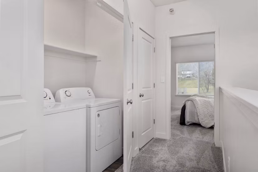 Laundry room with modern appliances at Haven Dell Apartments, offering convenience and efficiency for residents' daily needs