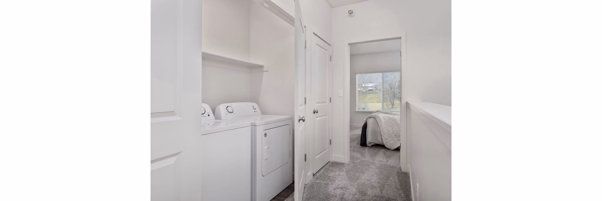 Laundry room with modern appliances at Haven Dell Apartments, offering convenience and efficiency for residents' daily needs