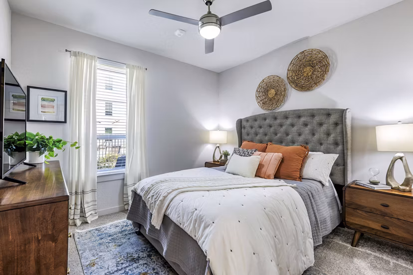 Bedroom with modern design and cozy decor in Album Benbrook Apartments