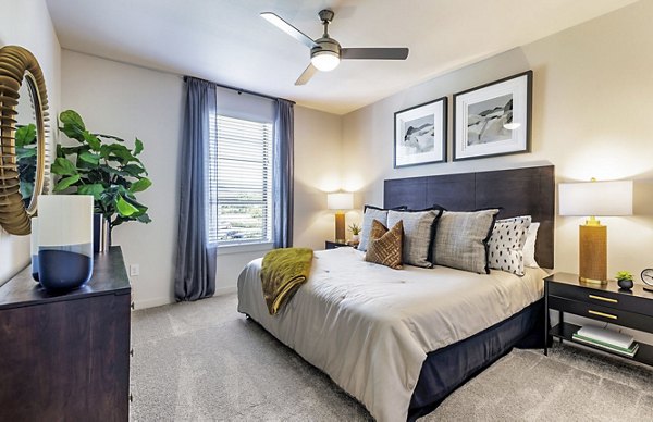 Spacious bedroom with modern decor at Album Benbrook Apartments, luxury living