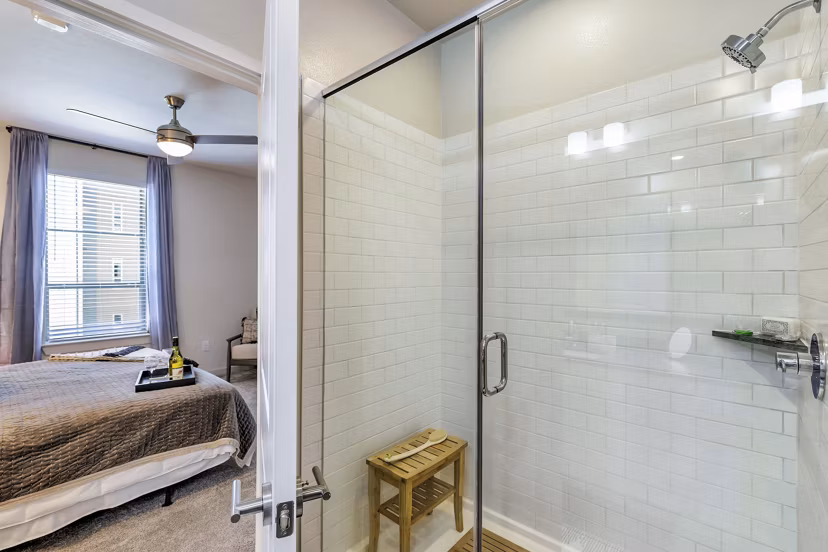 Modern bathroom featuring sleek fixtures and subway tile in Album Benbrook Apartments