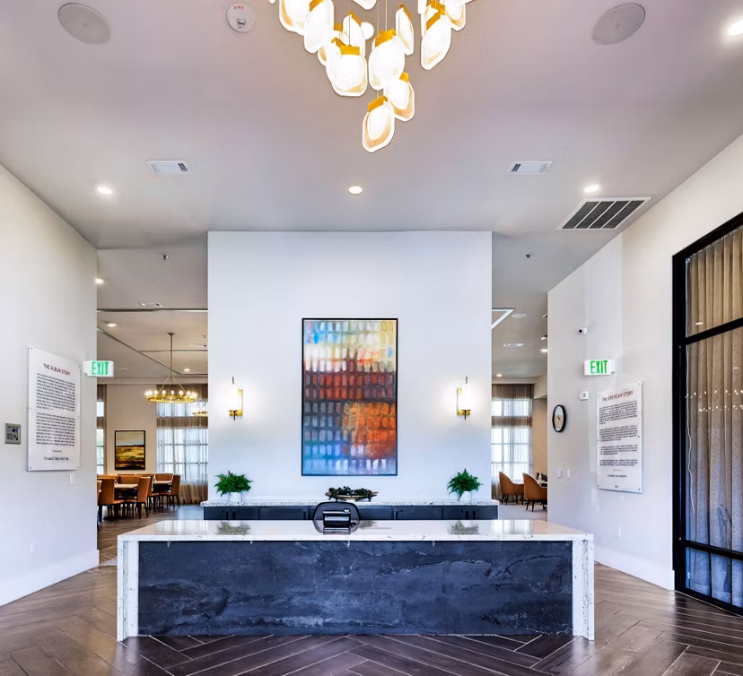 Modern clubhouse with stylish seating at Album Benbrook Apartments featuring luxury amenities and community spaces for social gatherings