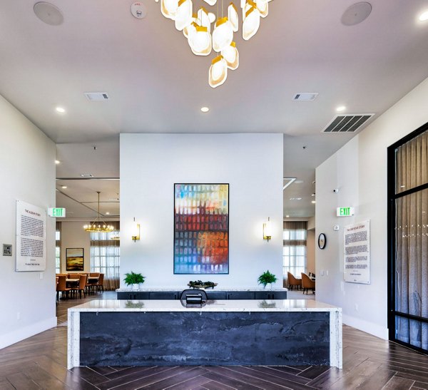 Modern clubhouse with stylish seating at Album Benbrook Apartments featuring luxury amenities and community spaces for social gatherings