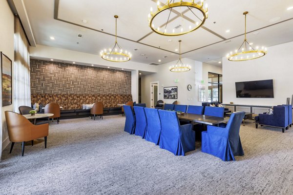 Modern stylish clubhouse with cozy seating at Album Benbrook Apartments
