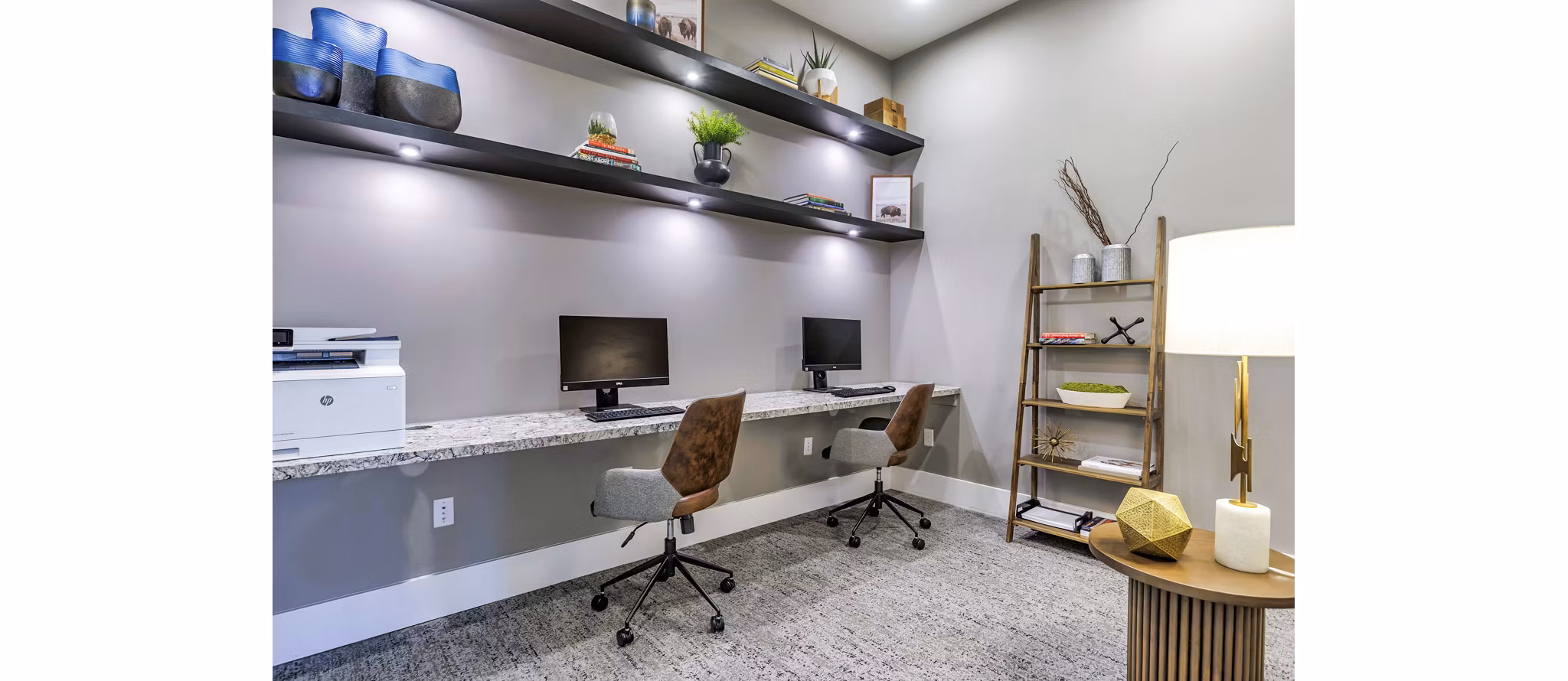 Clubhouse business center with workspace and computers at Album Benbrook Apartments, perfect for luxury apartment residents seeking productivity