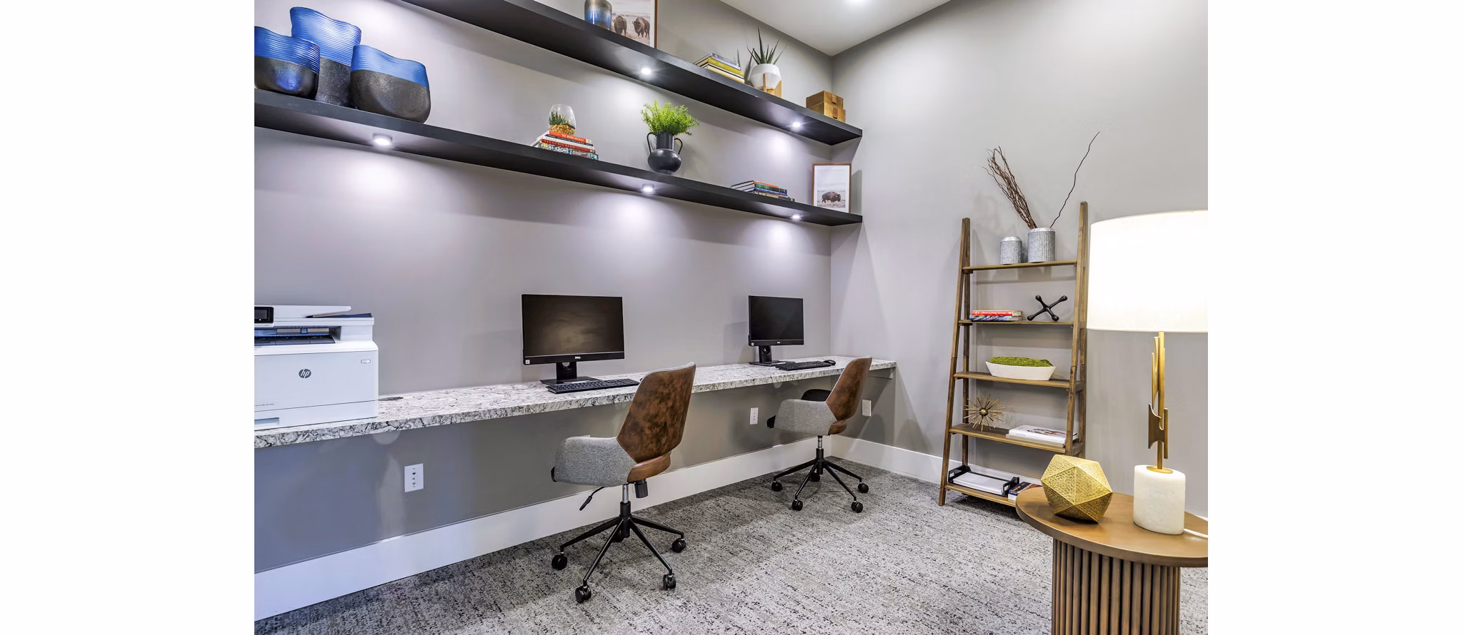 Clubhouse business center with workspace and computers at Album Benbrook Apartments, perfect for luxury apartment residents seeking productivity