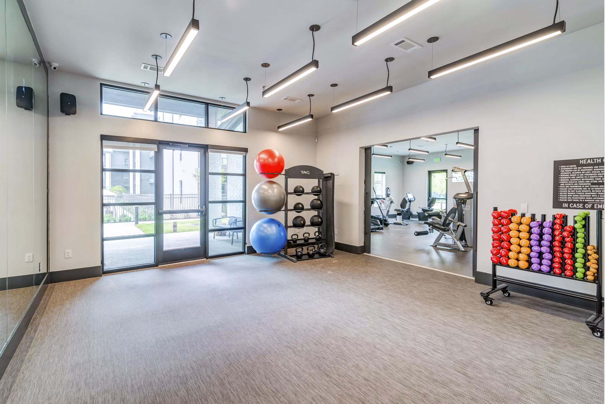 Modern fitness center with state-of-the-art equipment at Album Benbrook Apartments
