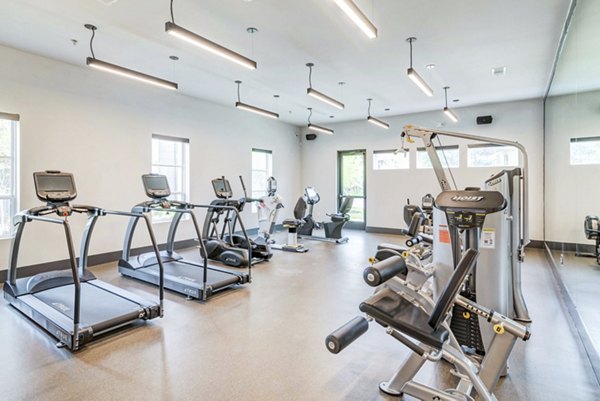 State-of-the-art fitness center at Album Benbrook Apartments with modern equipment