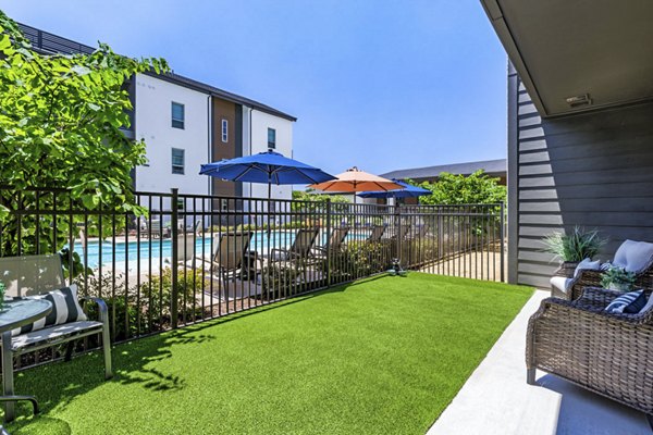 Inviting resident patio with comfortable seating at Album Benbrook Apartments, perfect for outdoor relaxation and social gatherings