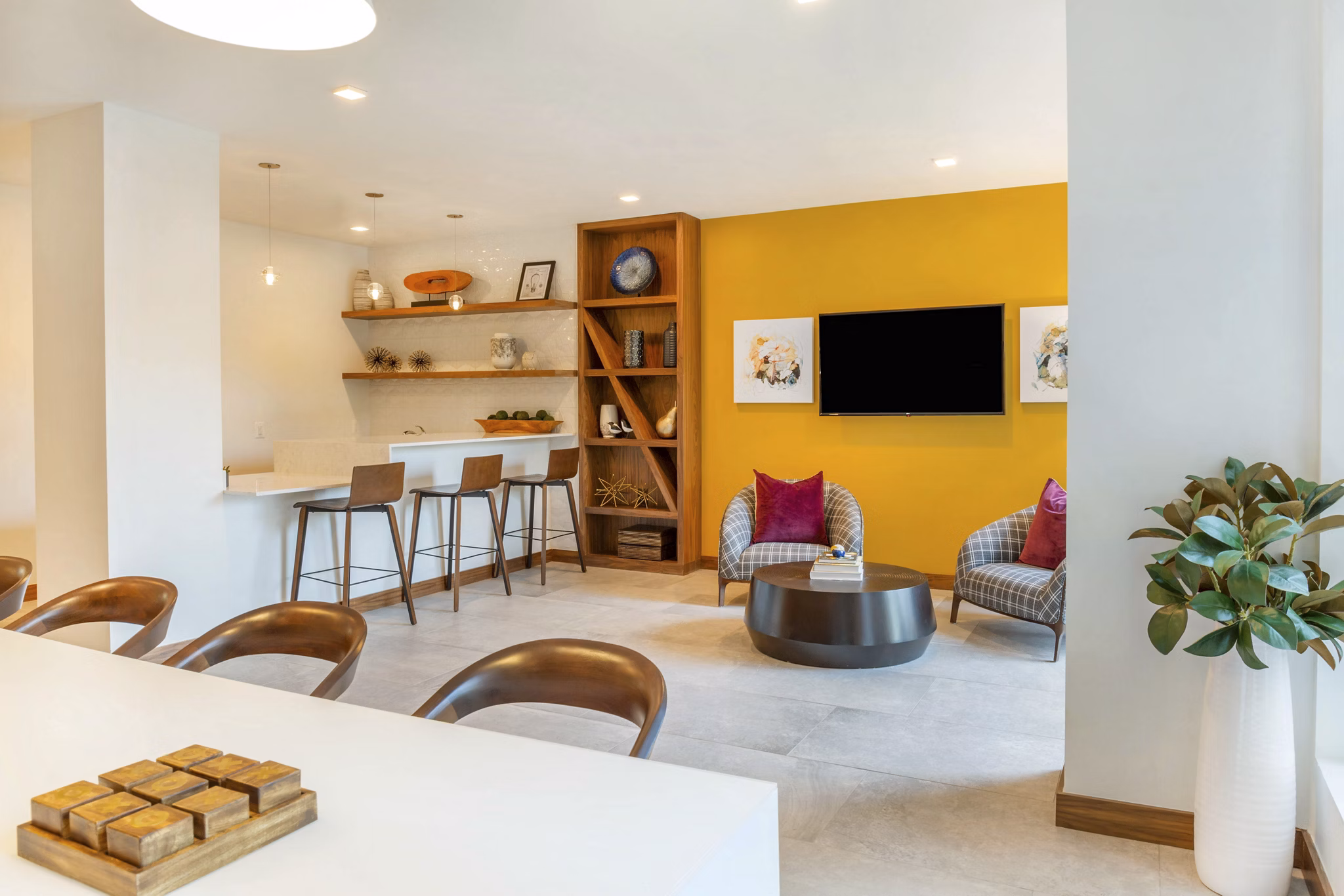 Clubhouse featuring modern seating and entertainment options at Potomac Towers Apartments