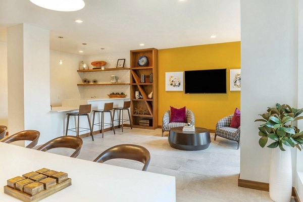 Clubhouse featuring modern seating and entertainment options at Potomac Towers Apartments