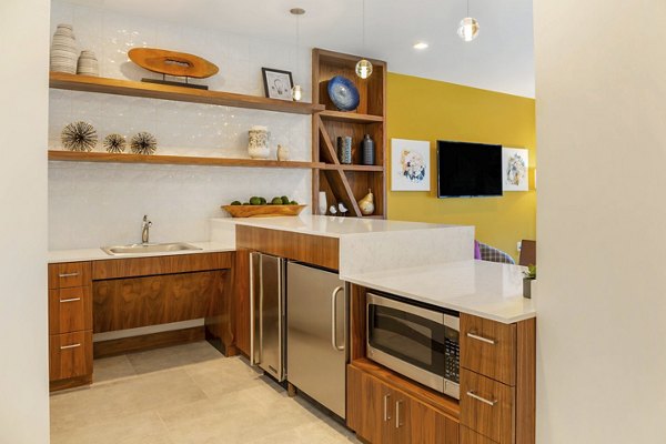 Elegant clubhouse with modern design at Potomac Towers Apartments, perfect for gatherings and relaxation in a luxury living community
