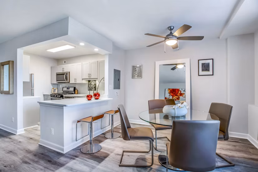 Elegant dining room with modern decor at Potomac Towers Apartments, offering luxury living space in a sophisticated setting
