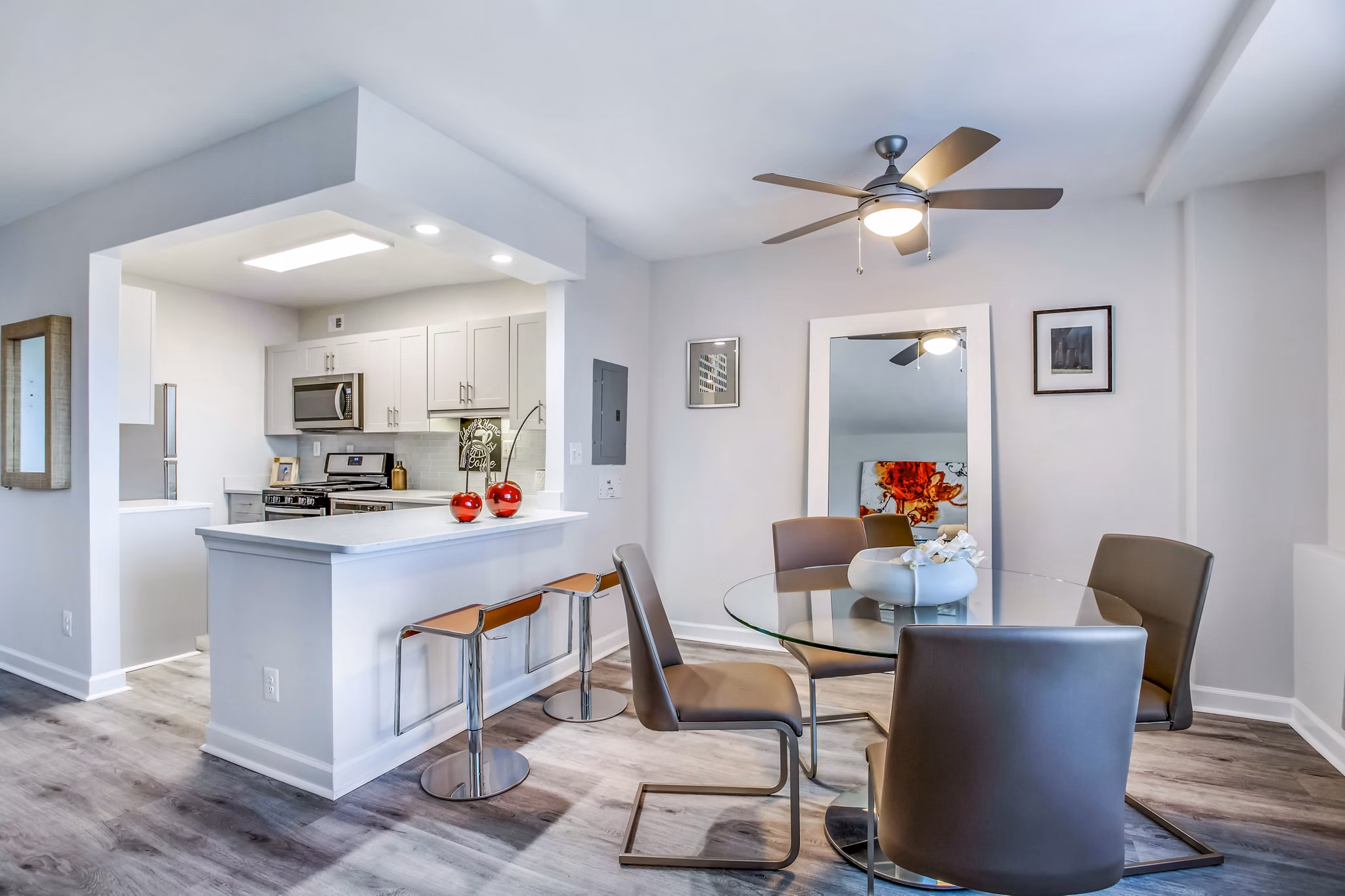 Elegant dining room with modern decor at Potomac Towers Apartments, offering luxury living space in a sophisticated setting
