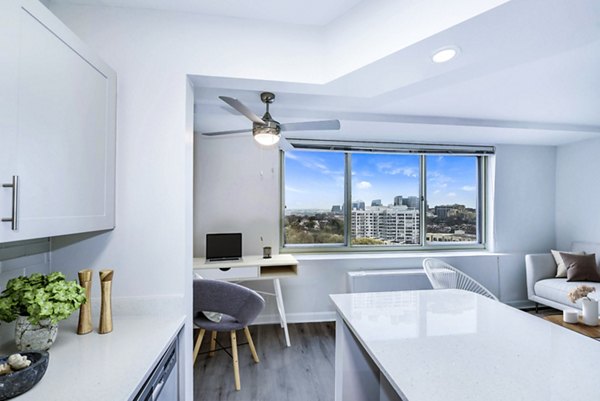 Modern kitchen with stainless steel appliances at Potomac Towers Apartments, Greystar luxury apartment community