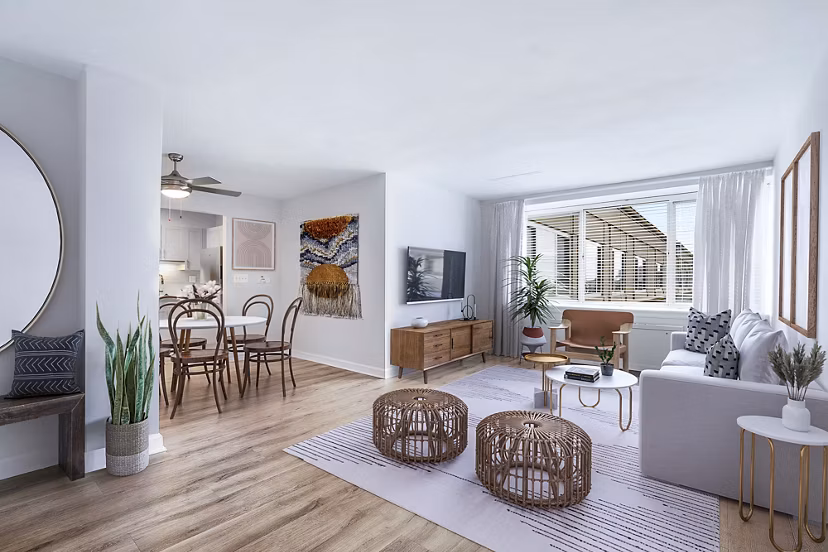 Modern living room with cozy seating and natural light at Potomac Towers Apartments in Arlington