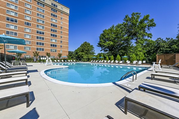 Luxurious pool facility at Potomac Towers Apartments with modern design and comfortable lounging areas