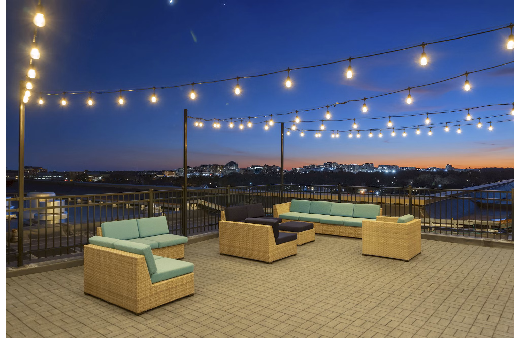 Cozy patio with seating and beautiful views at Potomac Towers Apartments, ideal for relaxation and enjoying outdoor living spaces