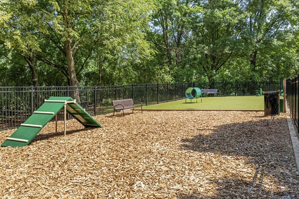 Dog park with agility equipment at Potomac Towers Apartments