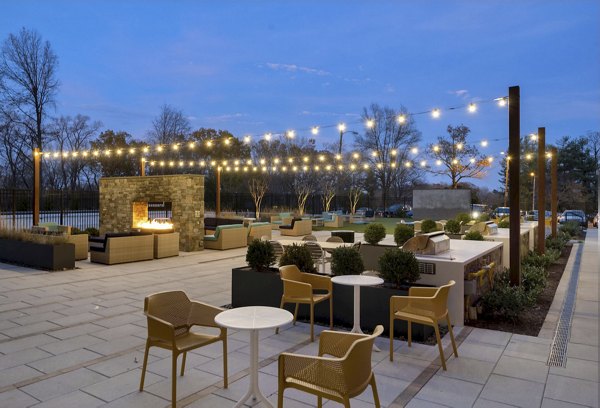 Potomac Towers Apartments: Stylish balcony with city views and outdoor seating in a luxury high-rise