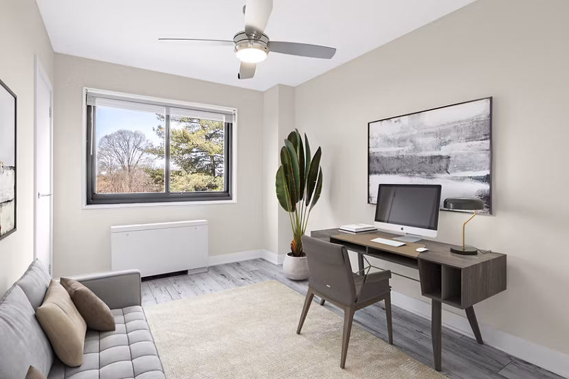 Den featuring cozy seating and modern decor in Shawnee Apartments