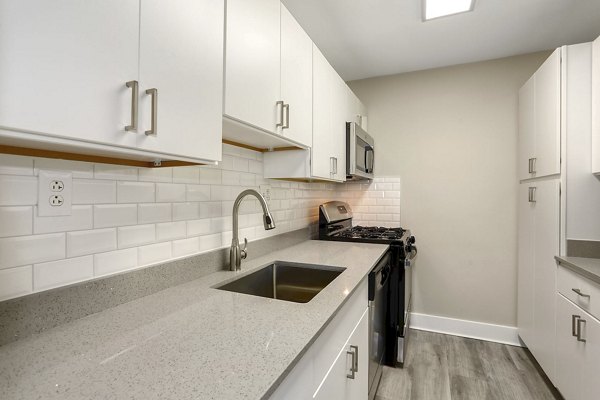 Kitchens with modern appliances and granite countertops in Shawnee Apartments Perfect blend of style and functionality