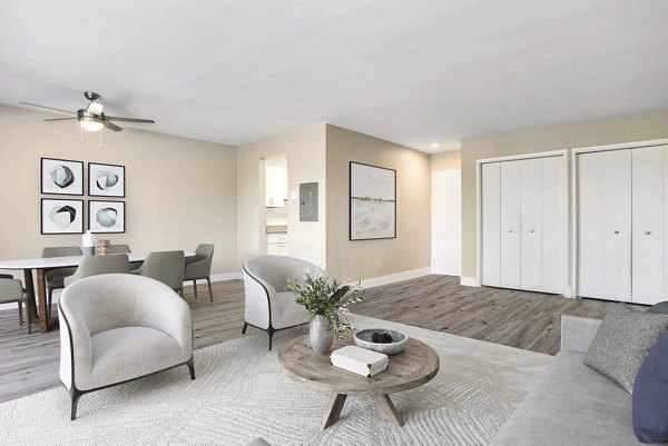 Cozy living room with contemporary decor at Shawnee Apartments, featuring plush seating and natural lighting for a welcoming atmosphere