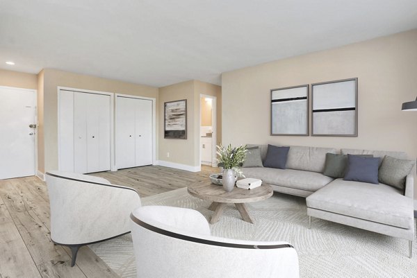 Spacious living room with modern decor and natural light at Shawnee Apartments