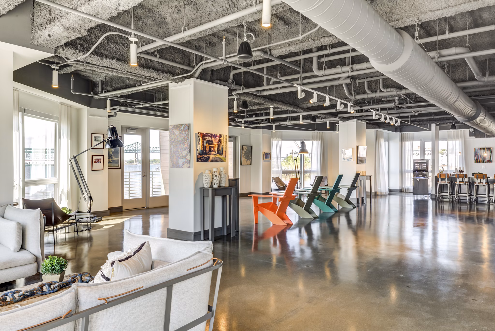 Clubhouse featuring modern design and luxury seating at Boston East Apartments in vibrant East Boston neighborhood