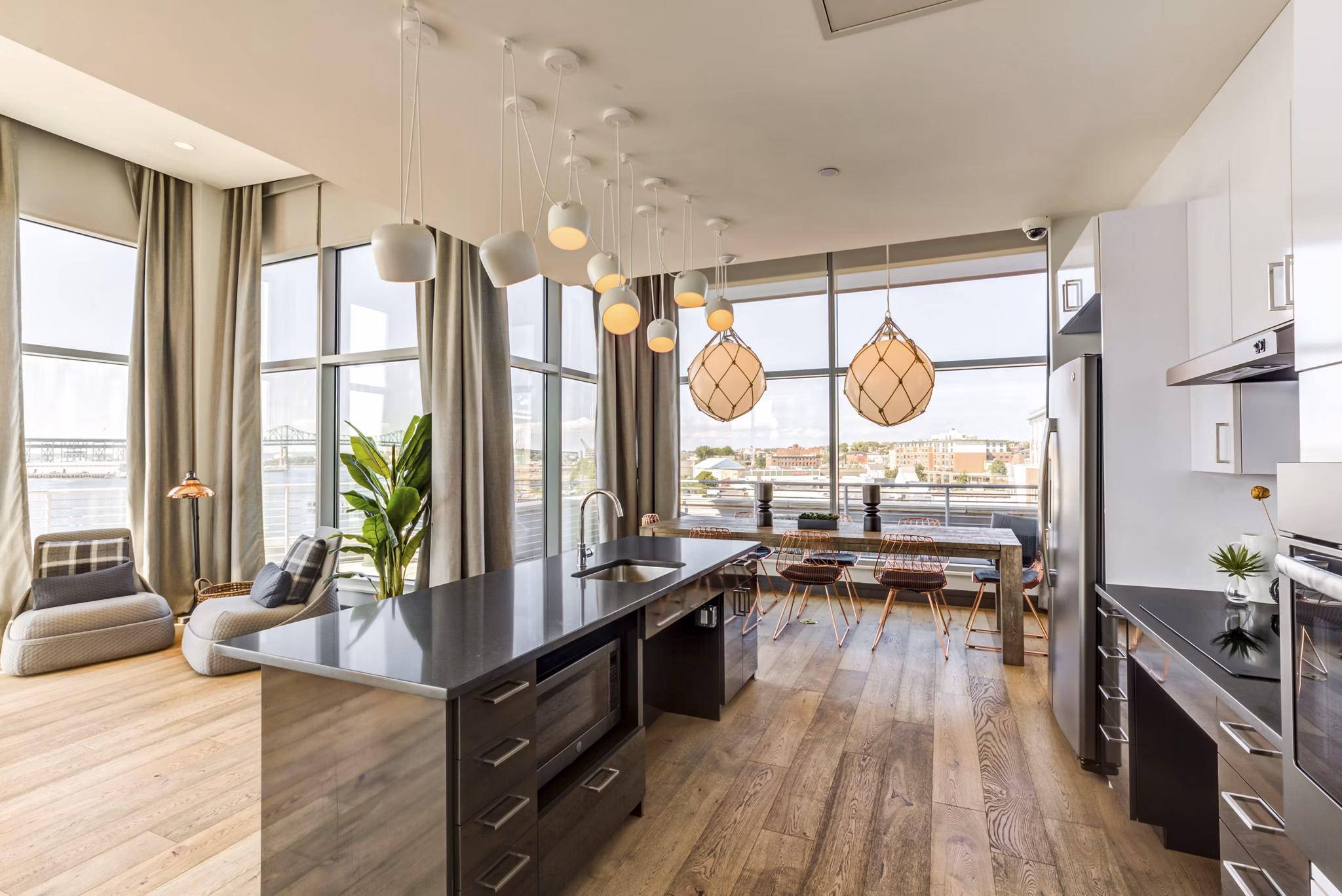 Elegant clubhouse with modern decor at Boston East Apartments, offering upscale social spaces and community events in luxury waterfront living