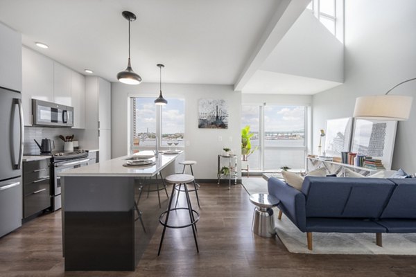 Stylish kitchen with marble countertops and stainless steel appliances in Boston East Apartments