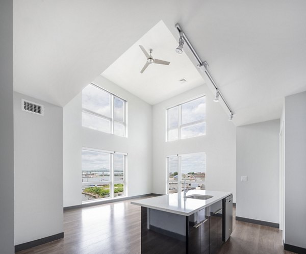 Contemporary kitchen with stainless steel appliances and granite countertops in Boston East Apartments